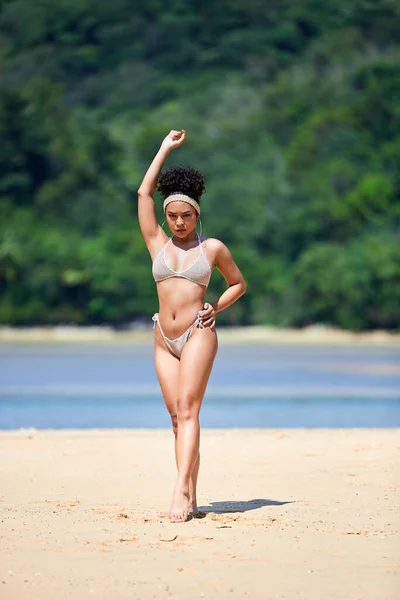 Young asian girl in bikini posing at Layan beach, Phuket, Thailand. Look in camera