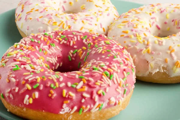 Bright donuts close-up. Beautiful dessert, decorated.Appetizing donut in pink frosting.