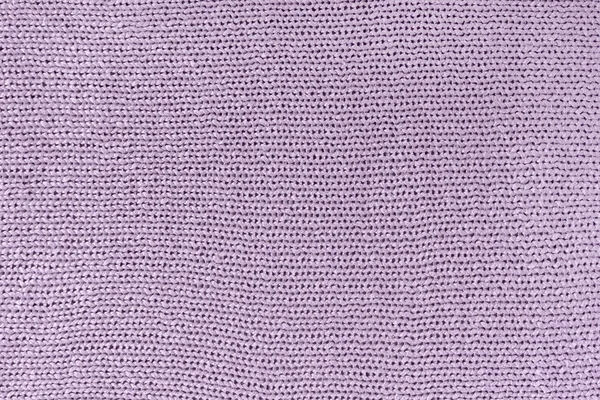 Monochrome texture of knitting. Blank background with loops. Lilac knitted product. — Stock Photo, Image