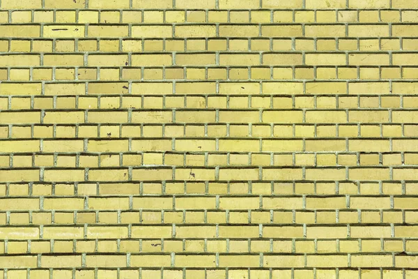 Yellow brick wall. Empty background for website or layout. Brickwork of small stones — Stock Photo, Image