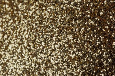 Pek çok küçük parıltının gri, parlak arkaplanı. Yakın plan, siteler ve yerleşimler için altın arkaplan