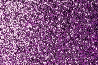 Violet shiny background from many small sparkles. Close-up, purple background for sites and layouts clipart