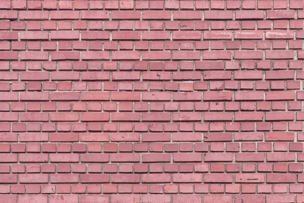 Vägg av liten röd-rosa tegelsten. Smidigt tegel. Bakgrund för webbplatser och layouter — Stockfoto