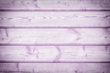 Tahtadan yapılmış bir çitin tonlu fotoğrafı. Düzen ve siteler için hafif leylak arkaplanı