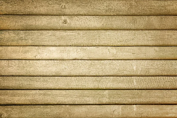 Toned foto de uma cerca feita de tábuas horizontais de madeira. Fundo marrom sujo, para layouts e sites — Fotografia de Stock
