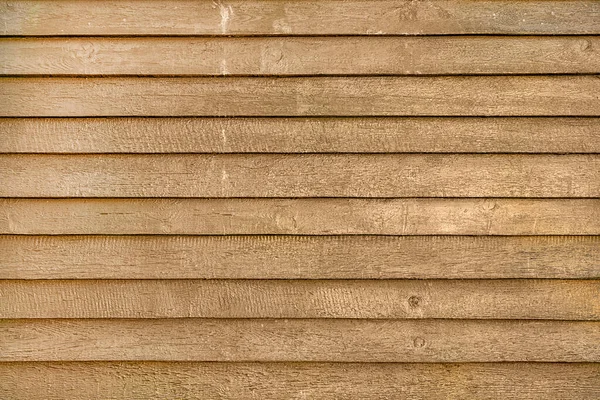 Foto vazia de uma cerca feita de tábuas de madeira. Fundo brilhantemente marrom, para layouts e sites — Fotografia de Stock