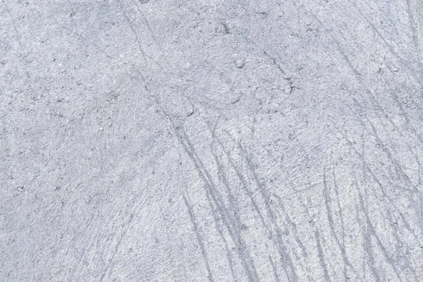 灰色の抽象的なコンクリート壁の背景。傷のついたセメントの質感の写真。レイアウトまたはサイトの場合 — ストック写真