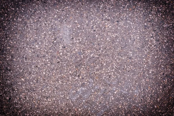 Toned photo of asphalt with a vignette. Background with pavement texture — Stock Photo, Image