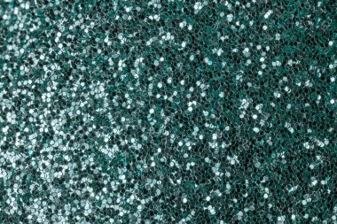 Dark green sparkles close-up. Bright festive background for sites and layouts clipart