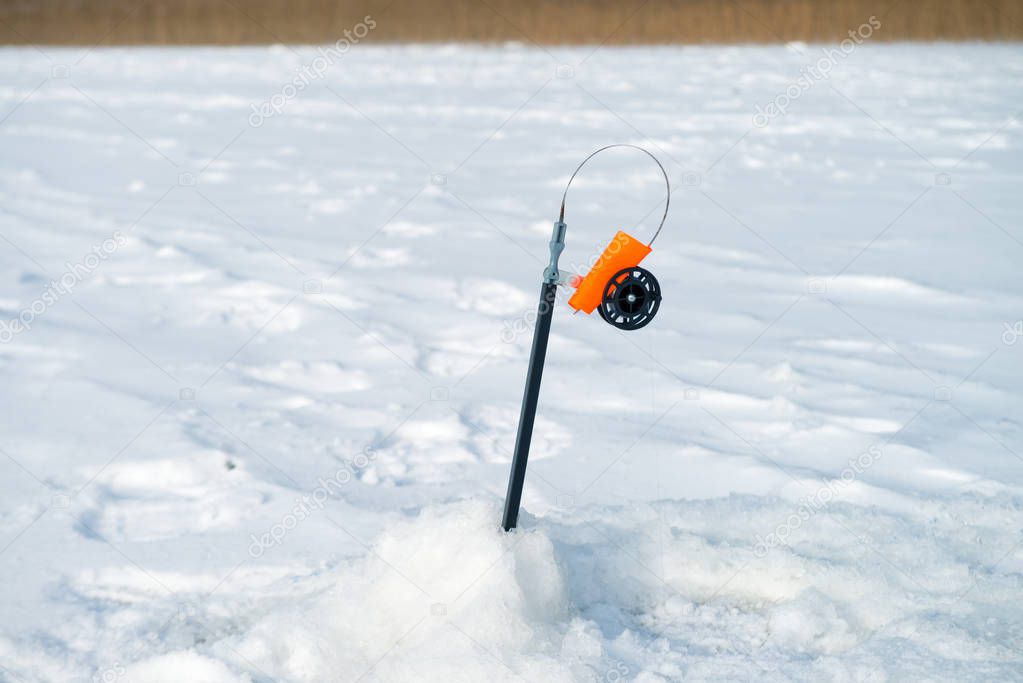 Fishing rod for winter fishing on the ice waiting for the fish b