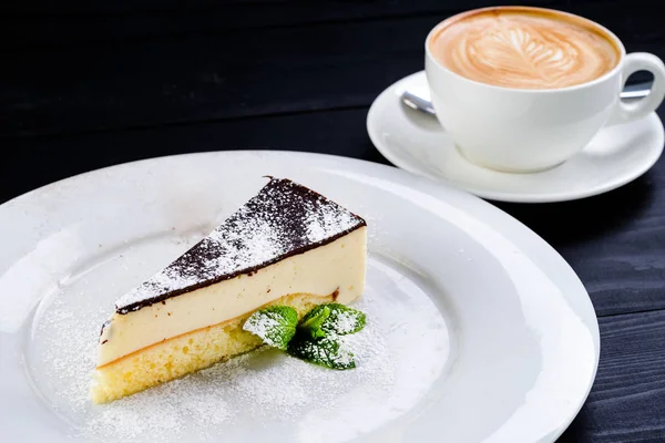 Cake tiramisu and a cup of hot coffee — Stock Photo, Image