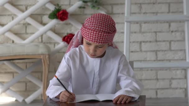 Little arabic boy studying at school — Stock Video