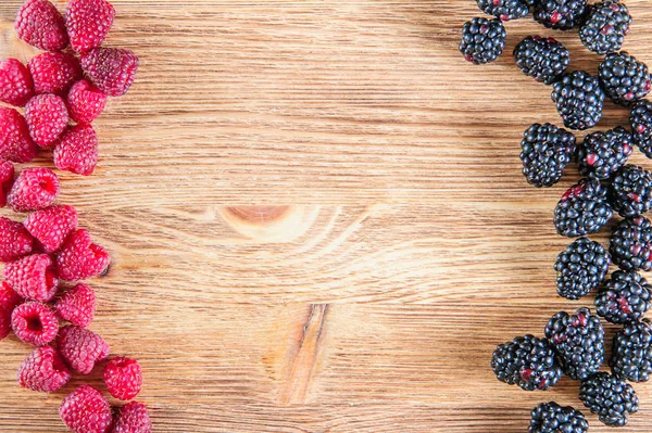 Various fresh summer berries, raspberries and black berries in old wooden background — Stock Photo, Image