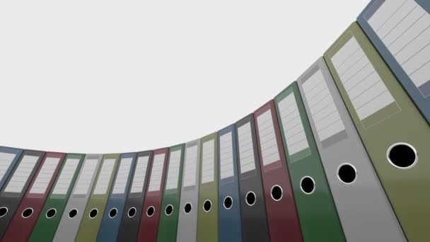Coloridos aglutinantes de oficina giran, de bajo ángulo de tiro ancho. Animación capaz de bucle inconsútil 4K — Vídeo de stock