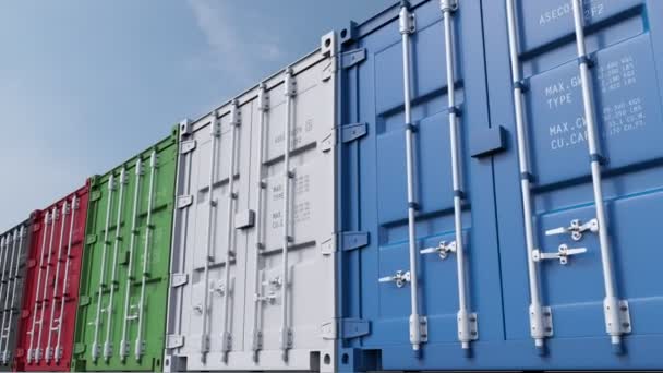 Row of multicolored cargo containers against blue sky. 4K seamless loopable dolly clip, ProRes — Stock Video