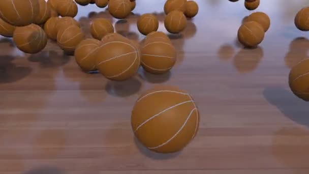 Множество баскетбольных мячей, катящихся и отскакивающих на деревянном полу. Клип 4K ProRes — стоковое видео