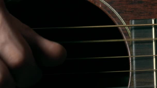 Guitar players hand over strings. Music performance. 4K macro video — Stockvideo