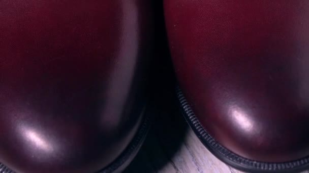 Pair of new classic mens boots. 4K pan telephoto lens video — Stock Video
