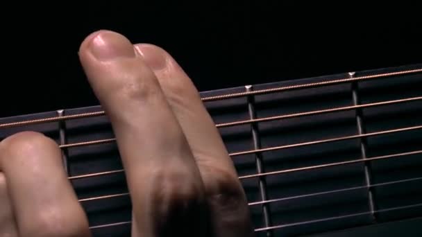Male hand touching strings on fretboard. Music performance. 4K macro video — Stock Video
