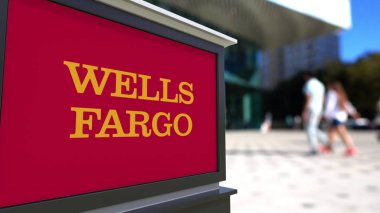 Street signage board with Wells Fargo logo. Blurred office center and walking people background. Editorial 3D rendering clipart