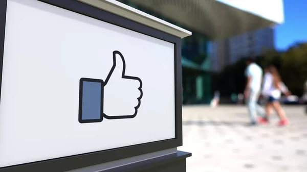 Placa de sinalização de rua com Facebook como botão polegar para cima — Fotografia de Stock
