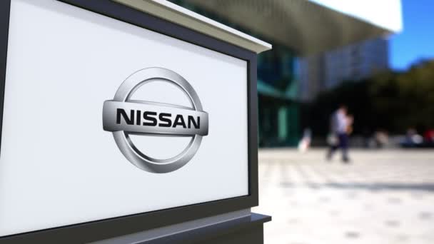 Street signage board with Nissan logo. Blurred office center and walking people background. Editorial 4K 3D rendering — Stock Video