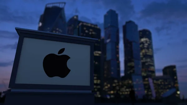 Street signage board with Apple Inc. logo in the evening. Blurred business district skyscrapers background. Editorial 3D rendering — Stock Photo, Image
