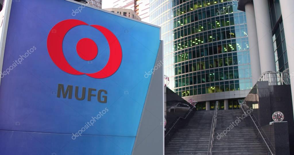 Street signage board with MUFG logo. Modern office center skyscraper and stairs background. Editorial 3D rendering United States