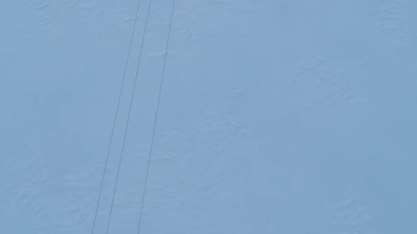 Aerial video of elecric wires and small power line pylons in winter. Top view — Stock Video
