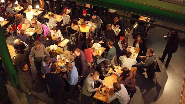 WARSAW, POLAND - DECEMBER, 21, 2016. People eating in the cafe. View from above shot — Stock Photo, Image