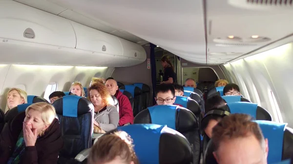 WARSAW, POLAND - DECEMBER, 24. Airliner cabin full of passengers — Stock Photo, Image