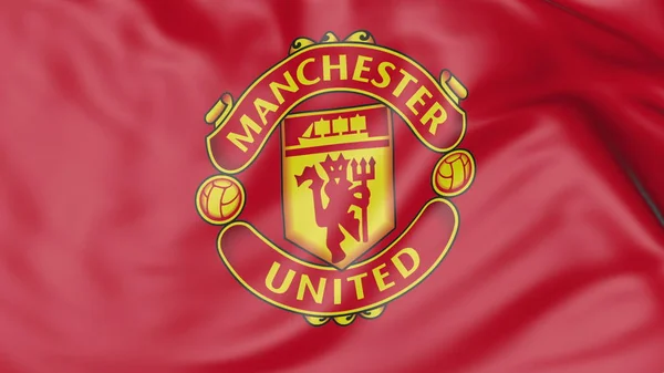 Zbliżenie: macha flagą z logo klubu piłki nożnej Manchester United F.C. — Zdjęcie stockowe