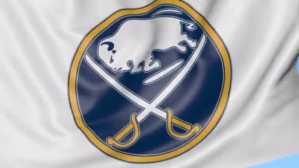 Close-up of waving flag with Buffalo Sabres NHL hockey team logo, seamless loop, blue background. Editorial animation. 4K — Stock Video