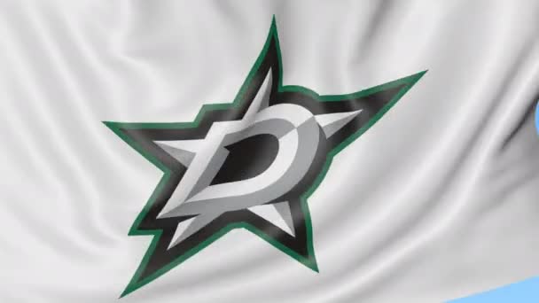 Close-up dari melambaikan bendera dengan Dallas Stars NHL tim hoki logo, loop mulus, latar belakang biru. Animasi editorial. 4K — Stok Video