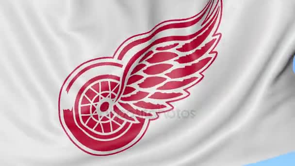 Primer plano de la bandera ondeante con el logotipo del equipo de hockey de Detroit Red Wings NHL, lazo sin costuras, fondo azul. Animación editorial. 4K — Vídeo de stock