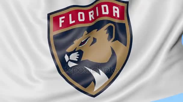 Крупный план размахивая флагом с флоридскими пантерами хоккейной команды НХЛ логотип, бесшовный цикл, синий фон. Редакционная анимация. 4K — стоковое видео