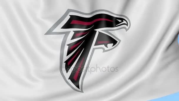 Close-up of waving flag with Atlanta Falcons NFL American football team logo, seamless loop, blue background. Editorial animation. 4K Stock Video