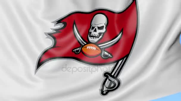 Close-up of waving flag with Tampa Bay Buccaneers NFL American football team logo, seamless loop, blue background. Editorial animation. 4K — Stock Video