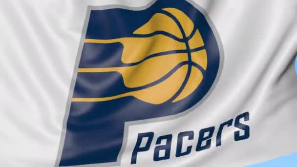 Gros plan du drapeau ondulé avec le logo de l'équipe de basket-ball Indiana Pacers NBA, boucle transparente, fond bleu. Animation éditoriale. 4K — Video