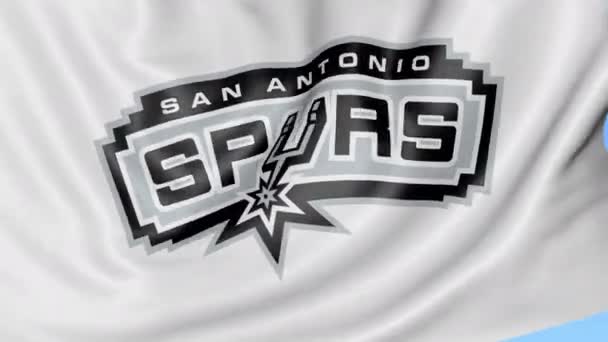 Detail mávat vlajkou s logo týmu basketbalové Nba San Antonio Spurs, bezešvé smyčka, modré pozadí. Redakční animace. 4k — Stock video