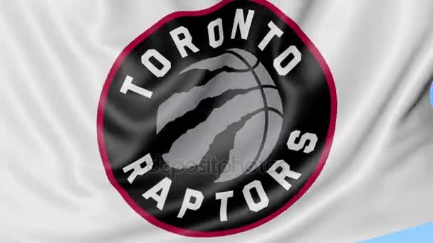 Primo piano della bandiera sventolante con il logo della squadra di basket NBA dei Toronto Raptors, anello senza cuciture, sfondo blu. Animazione editoriale. 4K — Video Stock