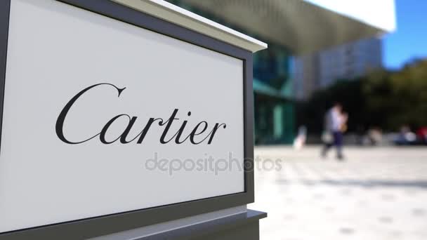 Σήμανση οδών σκάφους με λογότυπο Cartier. Κέντρο θολή office και περπάτημα άτομα φόντο. Συντακτική 3d rendering 4k — Αρχείο Βίντεο