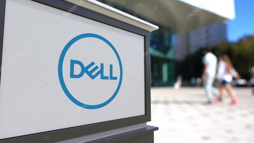 Street signage board with Dell Inc. logo. Blurred office center and walking people background. Editorial 3D United States