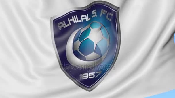 Gros plan du drapeau ondulé avec le logo du club de football Al Hilal FC, boucle transparente, fond bleu. Animation éditoriale. 4K — Video