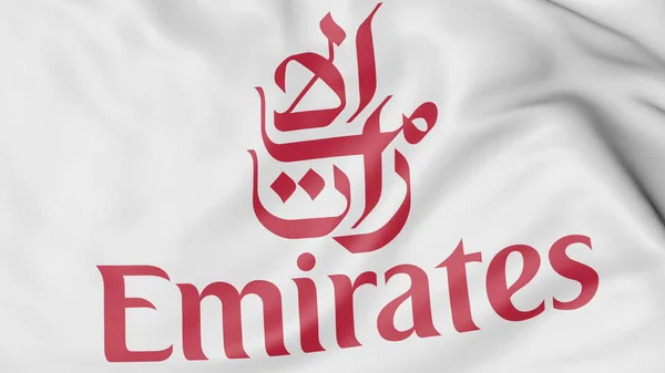 Close-up dari melambaikan bendera dengan logo Emirates Airline, editorial 3D rendering — Stok Foto