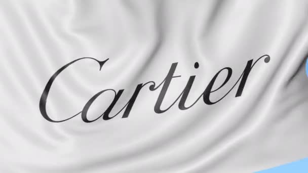 Primer plano de la bandera ondeante con el logotipo de Cartier, bucle sin costuras, fondo azul, animación editorial. 4K ProRes — Vídeo de stock