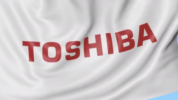 Primer plano de la bandera ondeante con el logotipo de Toshiba Corporation, bucle sin costuras, fondo azul, animación editorial. 4K ProRes — Vídeo de stock