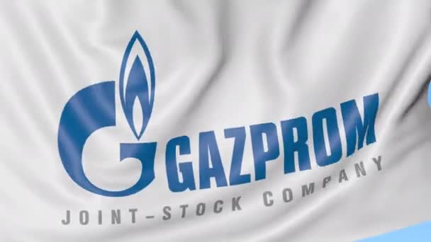 Крупный план размахивания флагом с логотипом "Газпрома", бесшовный цикл, синий фон, редакционная анимация. 4K ProRes — стоковое видео