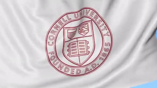 Primer plano de la bandera ondeante con el emblema de la Universidad de Cornell, lazo sin costuras, fondo azul. Animación editorial. 4K — Vídeos de Stock
