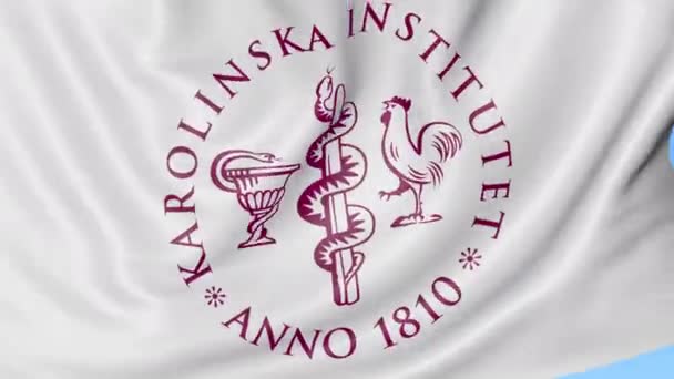 Primer plano de la bandera ondeante con el emblema del Instituto Karolinska, lazo sin costuras, fondo azul. Animación editorial. 4K — Vídeos de Stock